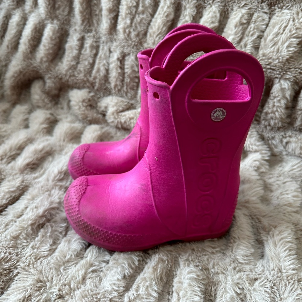 Pink rubber rain boots